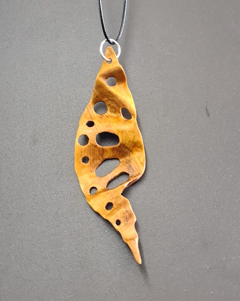 Rimu hand carved holey leaf necklace back
