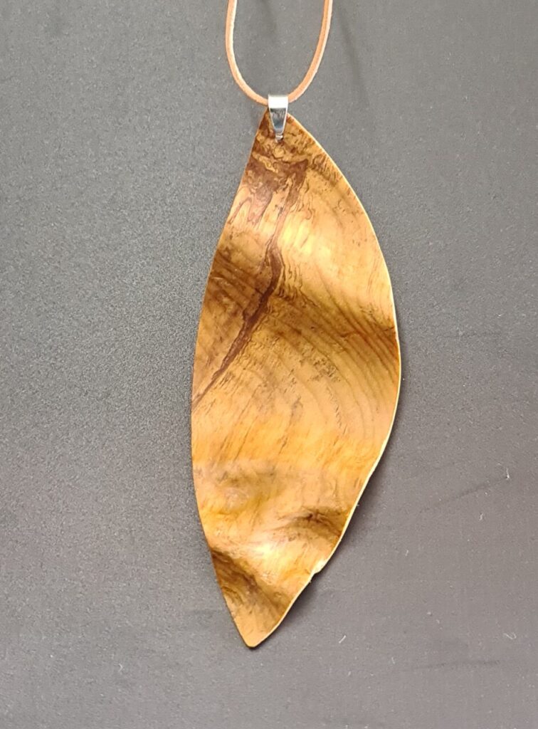 Rimu hand carved leaf necklace back