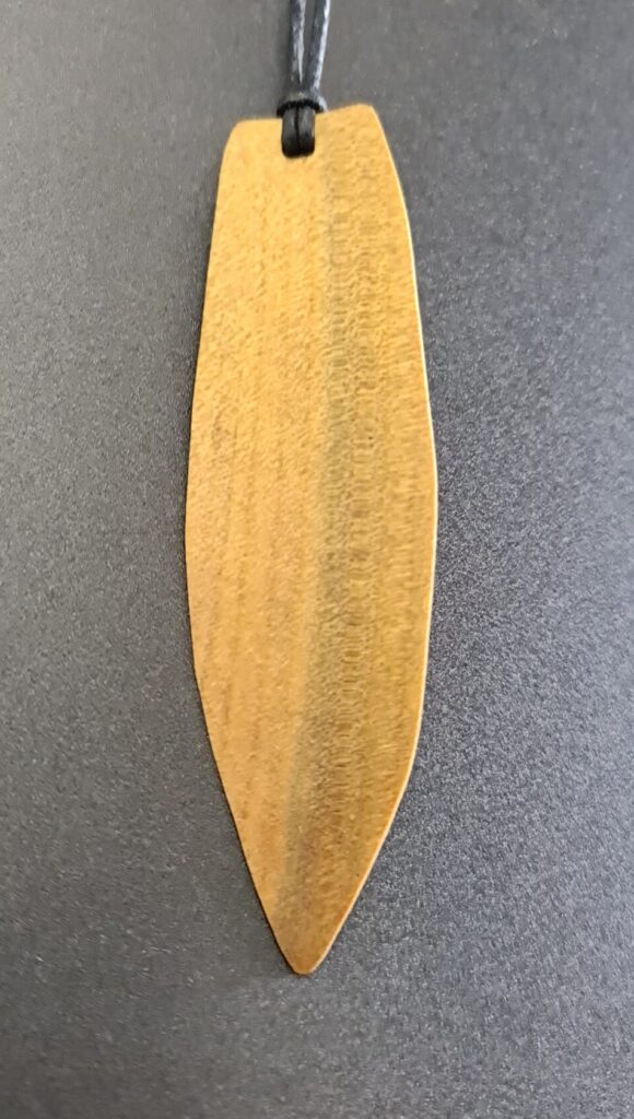 Surfboard rare wood necklace swamp Kauri back