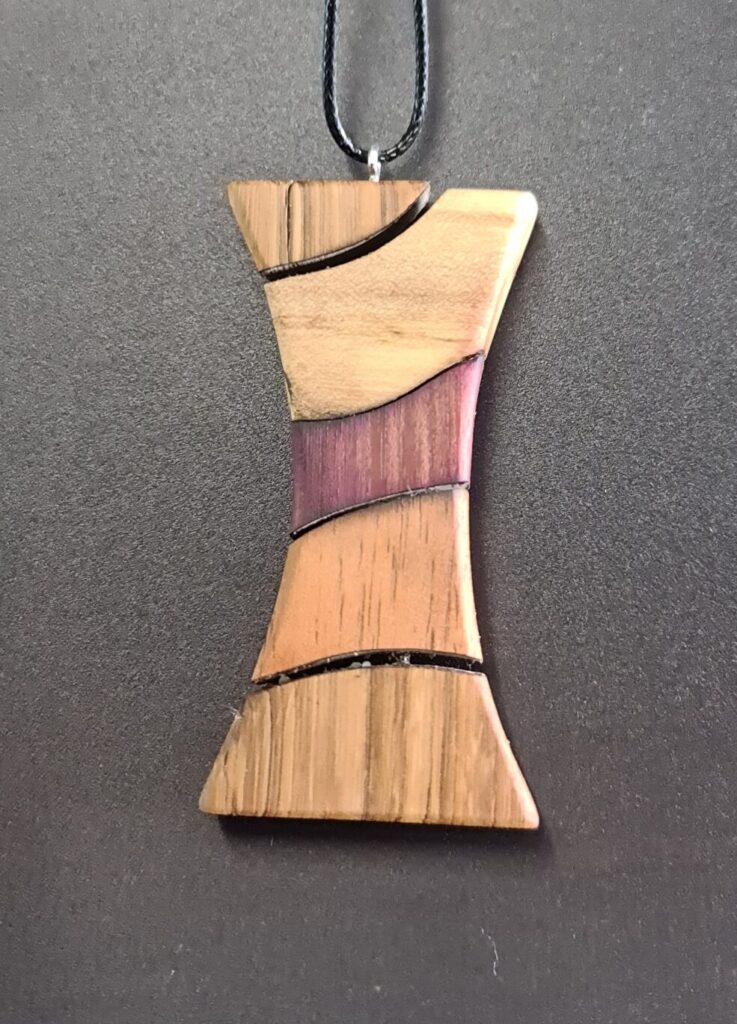 Large Hourglass Segmented Pin rare wood necklace back