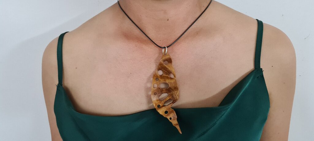 Rimu hand carved holey leaf necklace
