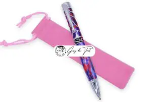 A pink velvet drawstring pen pouch, designed for protecting woodturned pens.