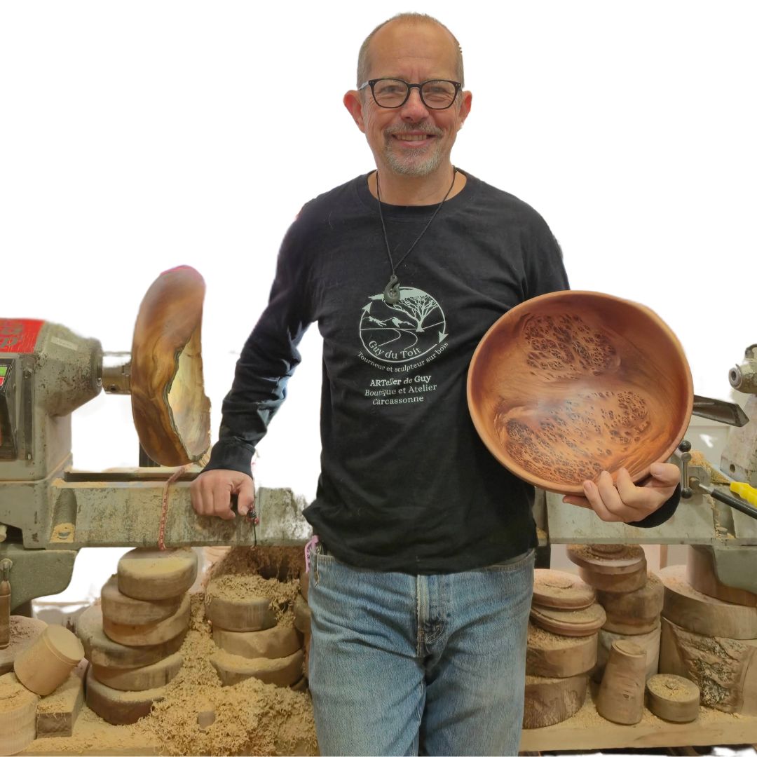 Guy du Toit working at his woodturning lathe in his French studio workshop
