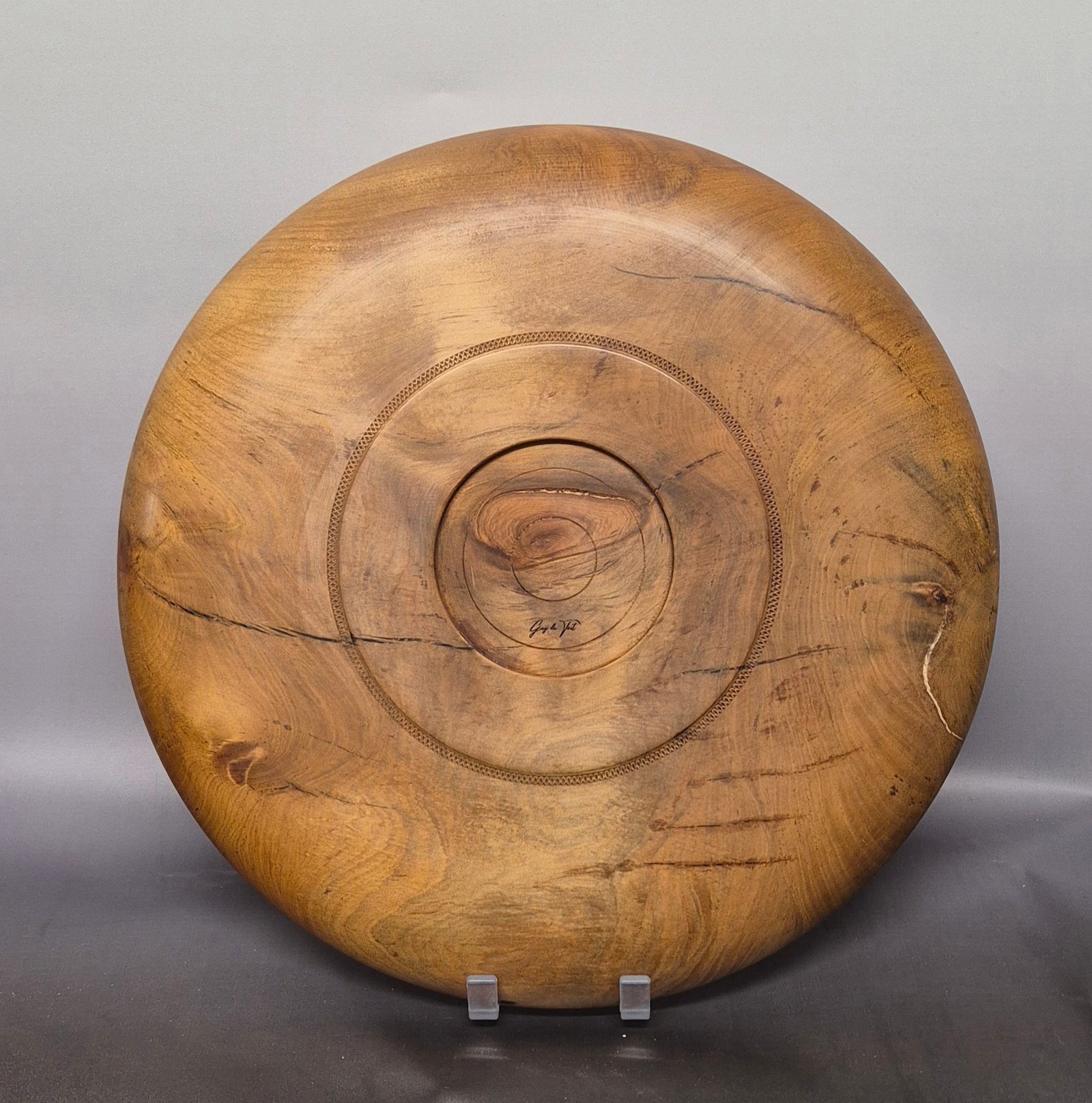 Back view of handcrafted swamp kauri platter with natural golden grain
