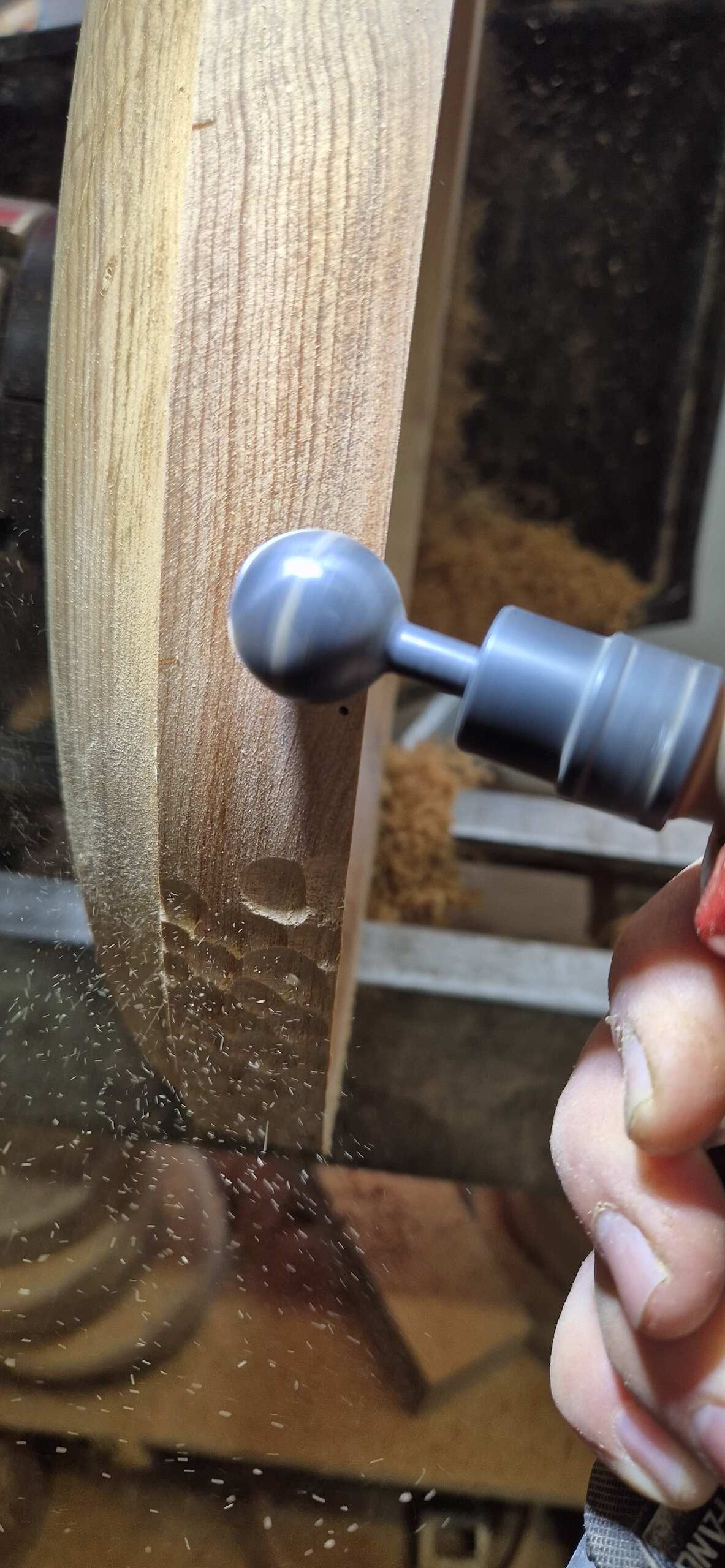 Process of carving the wave pattern on the rim of the bowl