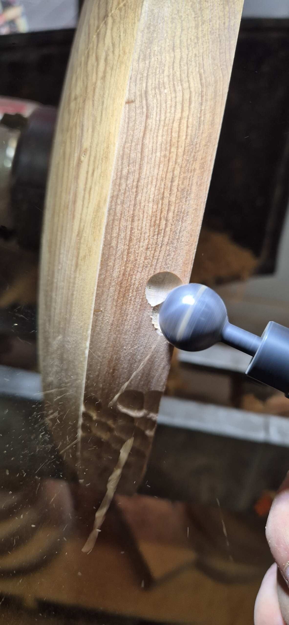 Process of carving the wave pattern on the rim of the bowl