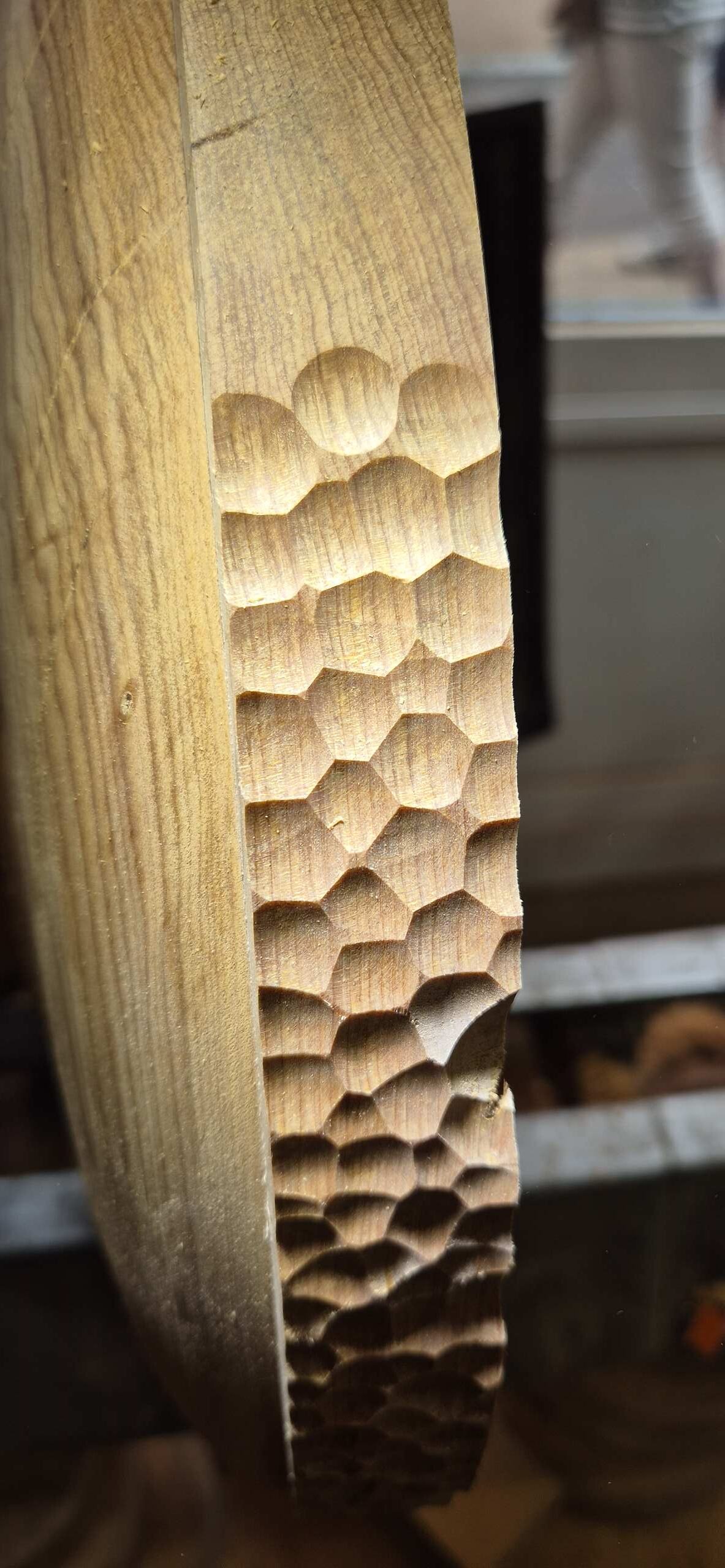 Process of carving the wave pattern on the rim of the bowl