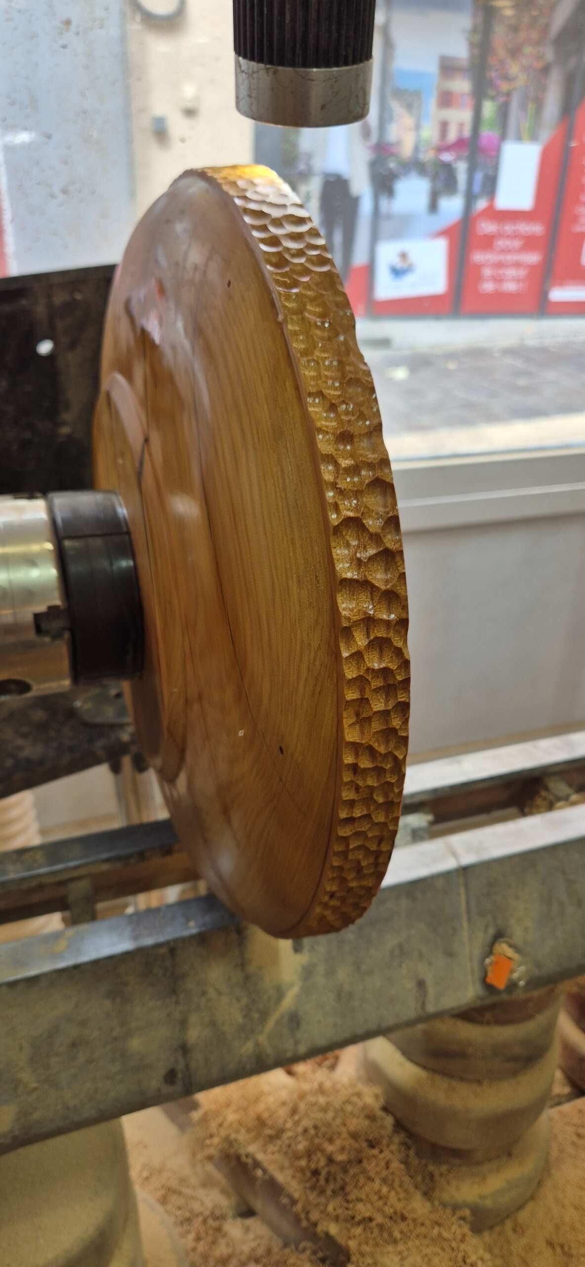 Process of carving the wave pattern on the rim of the bowl