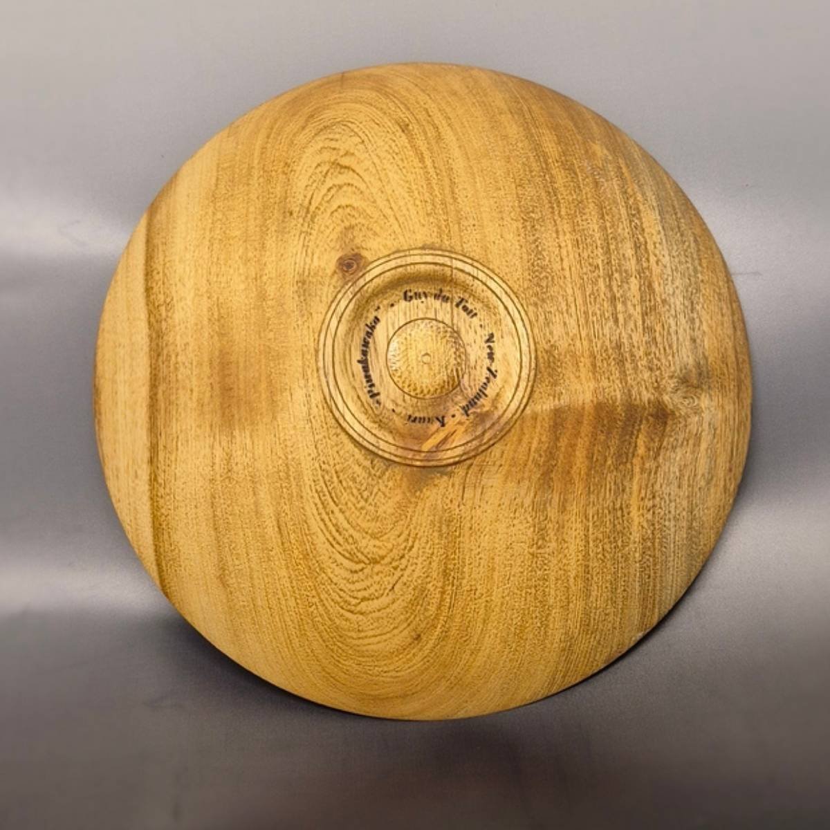 Back view of handcrafted kauri bowl with natural golden grain