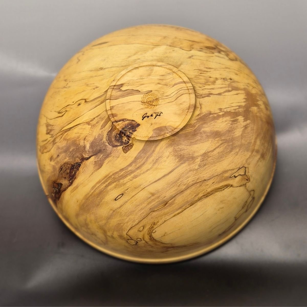 Back view of handcrafted spalted birch bowl with natural spalting patterns
