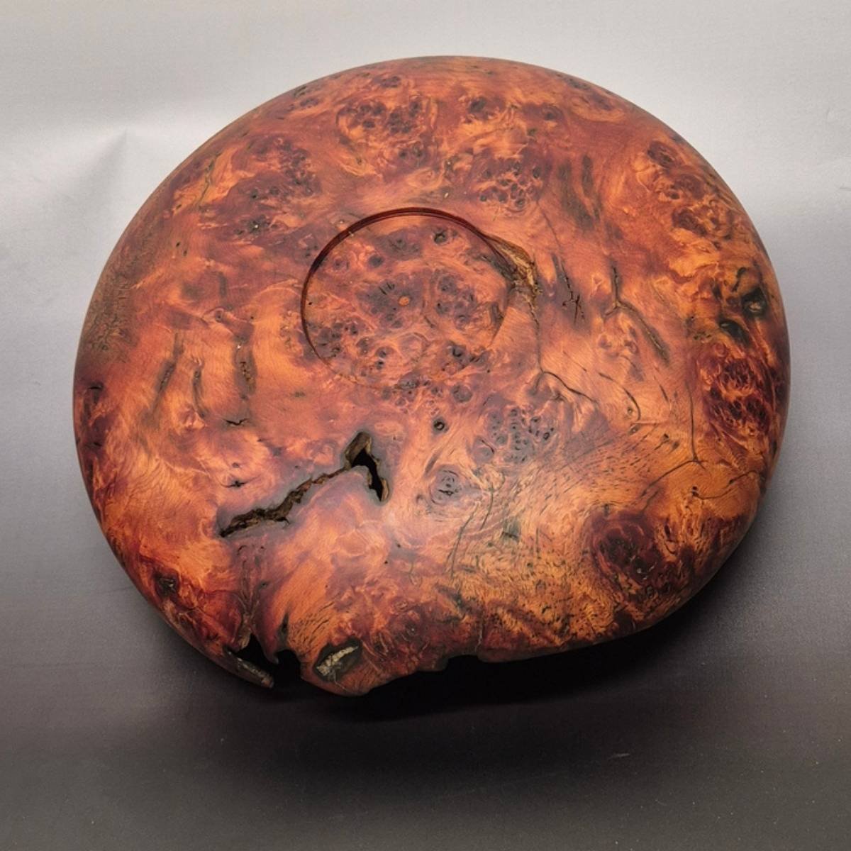 Back view of handcrafted red beech burl bowl with organic edge
